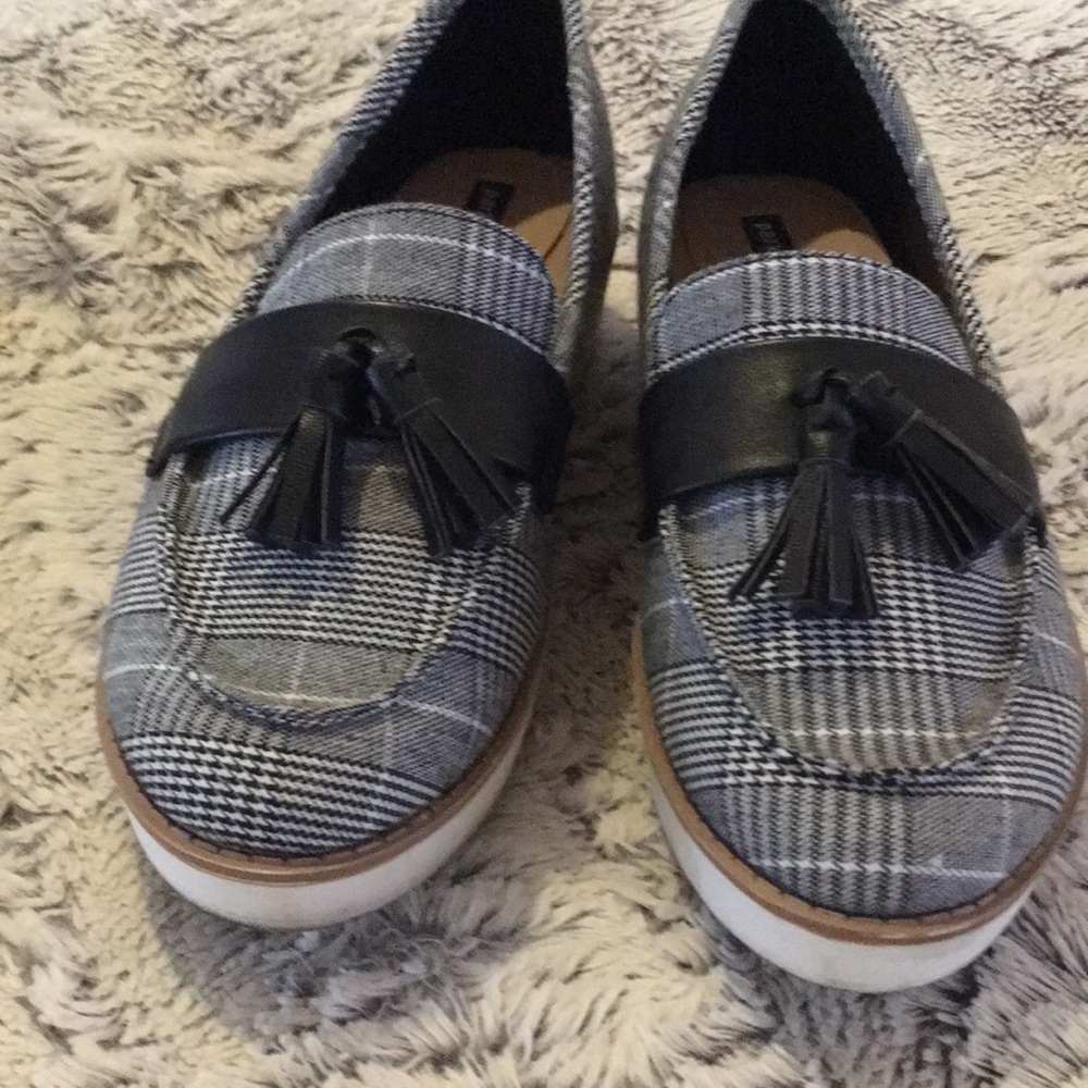 Parker & Sky plaid loafers with tassels and white bottoms.